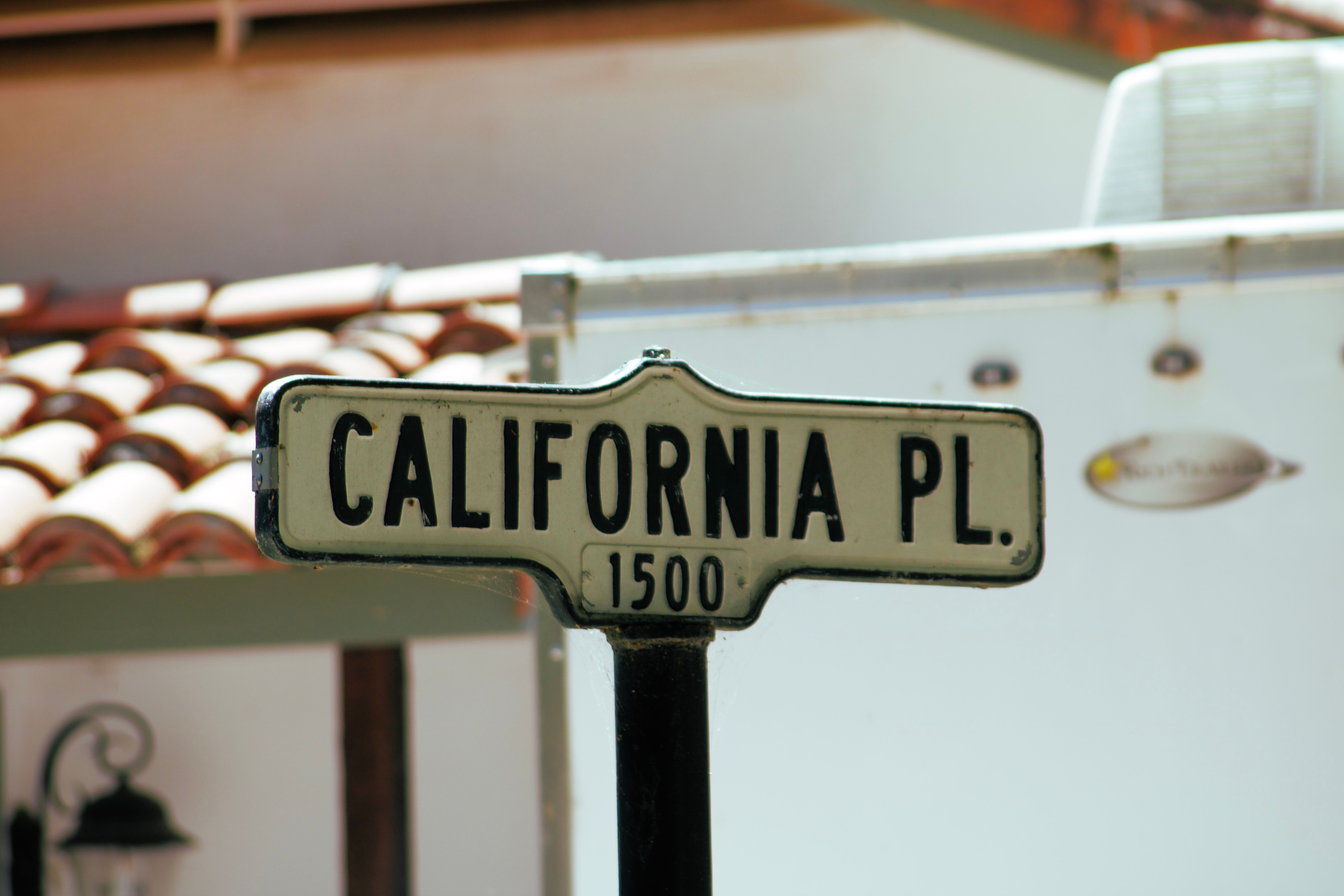Vintage California street sign in a sunlit neighborhood, reflecting the firm's Lafayette, California roots